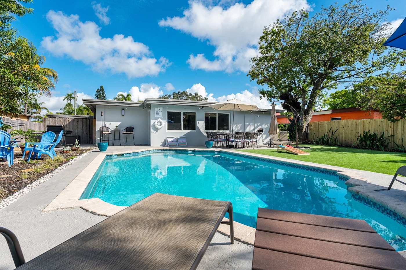 The Fairway: Heated pool with sun loungers on the deck