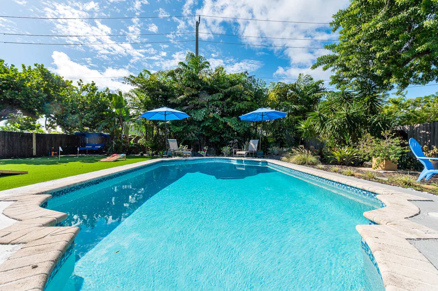 The Fairway: Heated pool, with parasols and planting around the deck