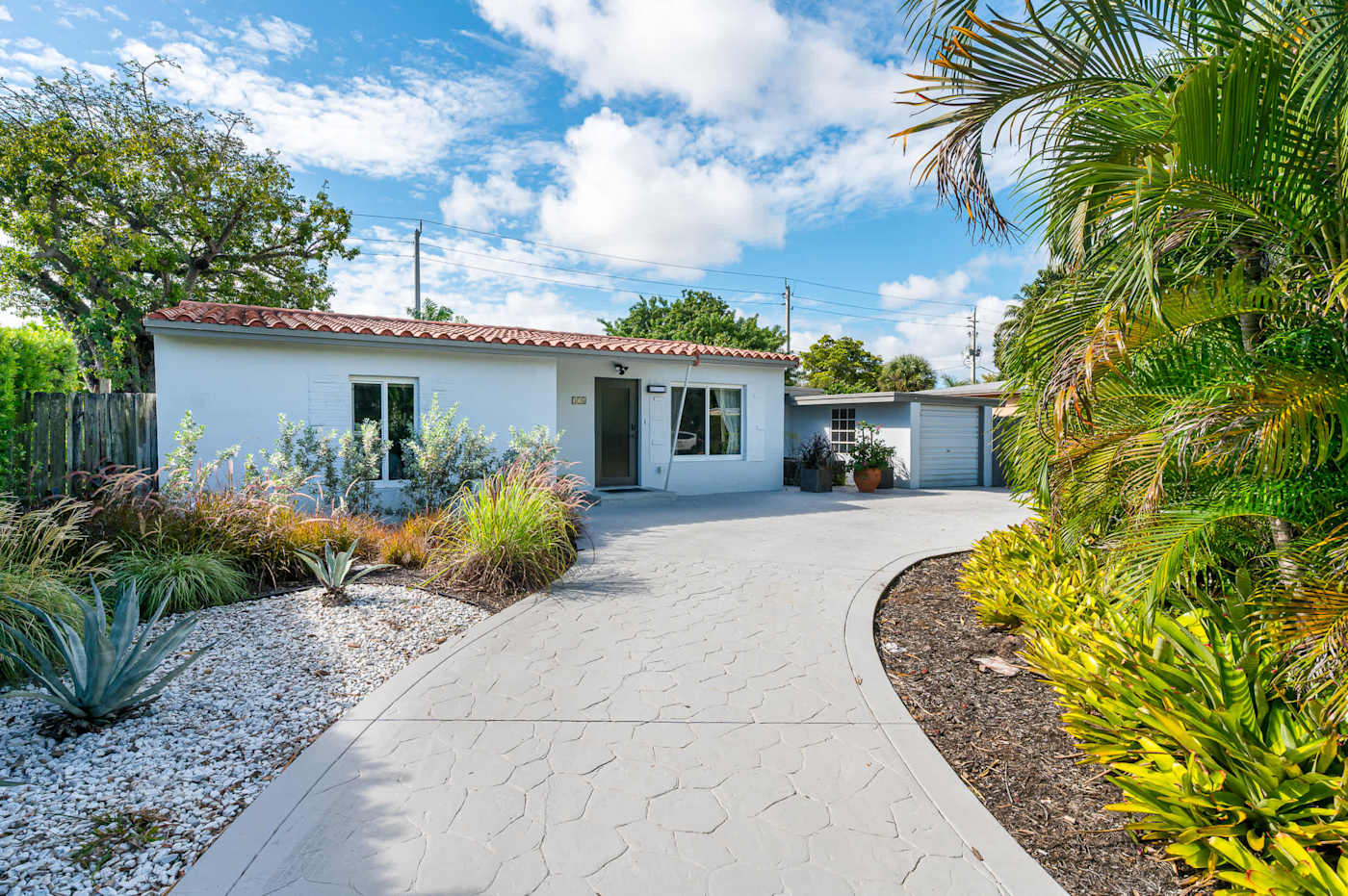 The Fairway: The drive and front garden, with planting along the path