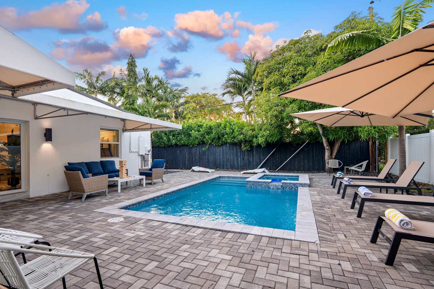 Casa Pura Vida: Pool deck at golden hour, with lounge seating along the side