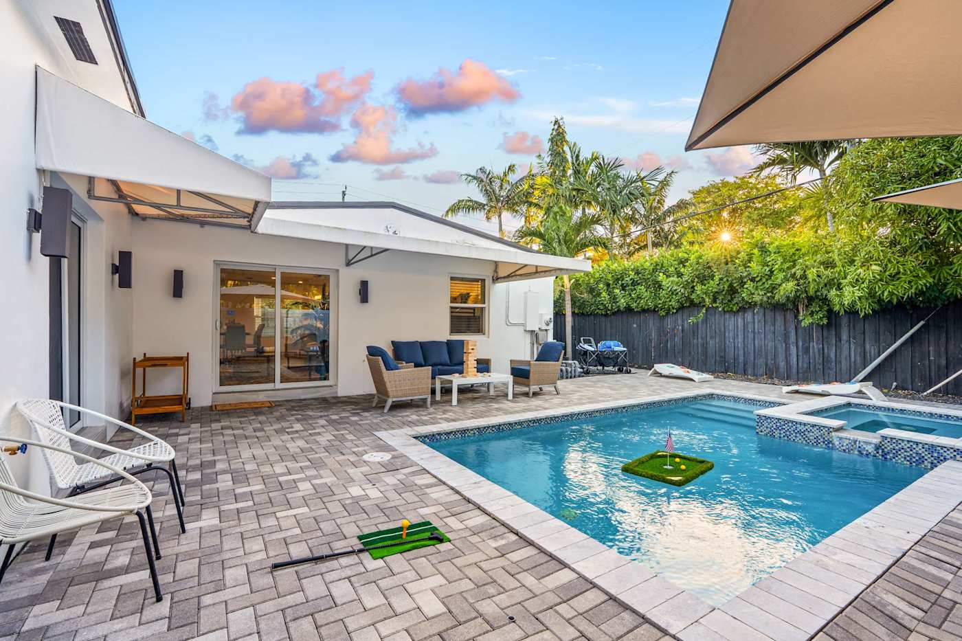 Casa Pura Vida: Pool and hot tub in daylight, with the covered lounge alongside