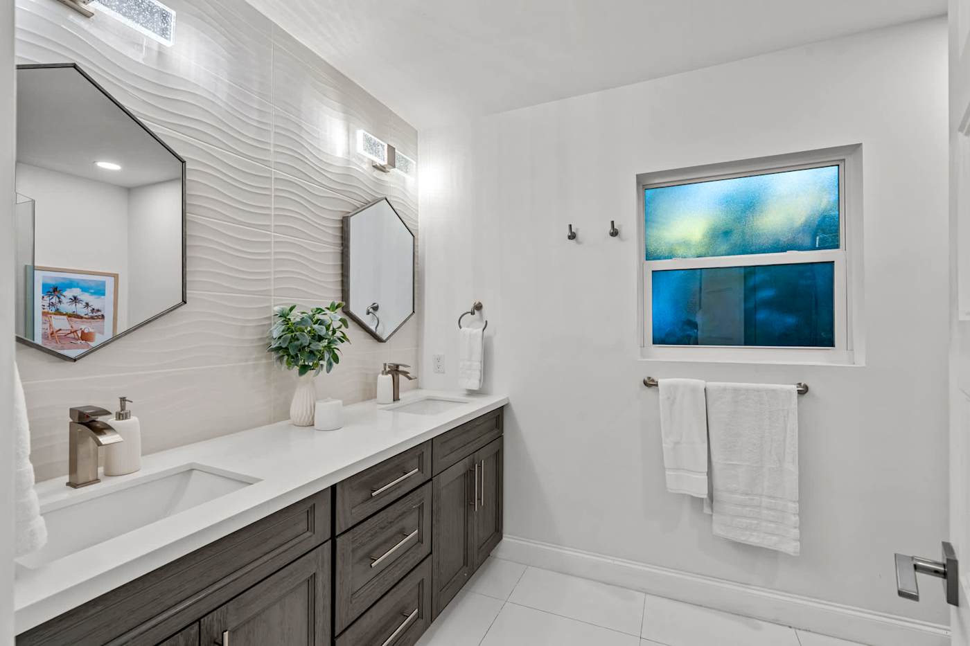 Casa Pura Vida: Double vanity bathroom with stone top and mirror