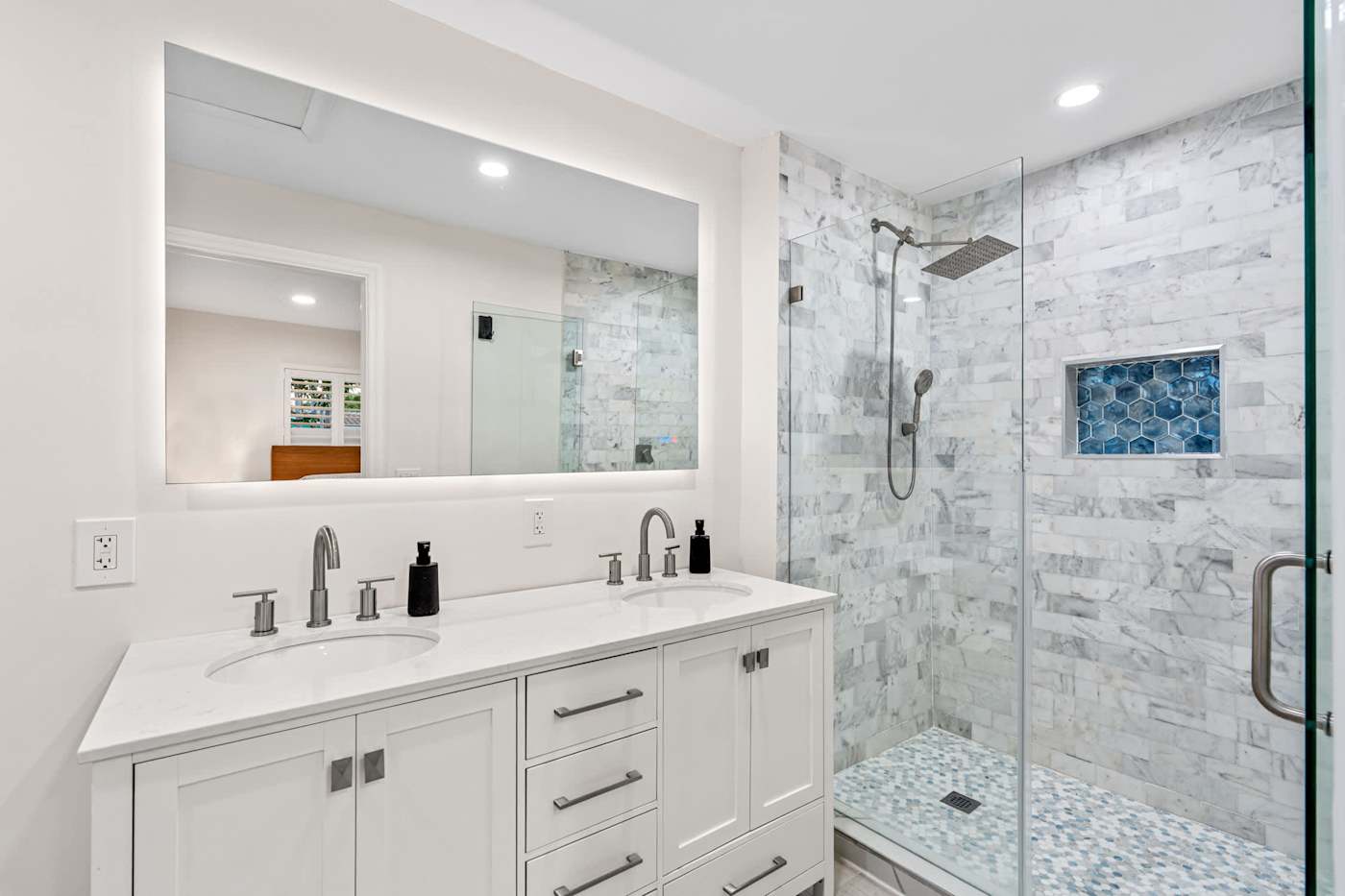 Canal House: Bathroom with vanity, large mirror and a glass shower