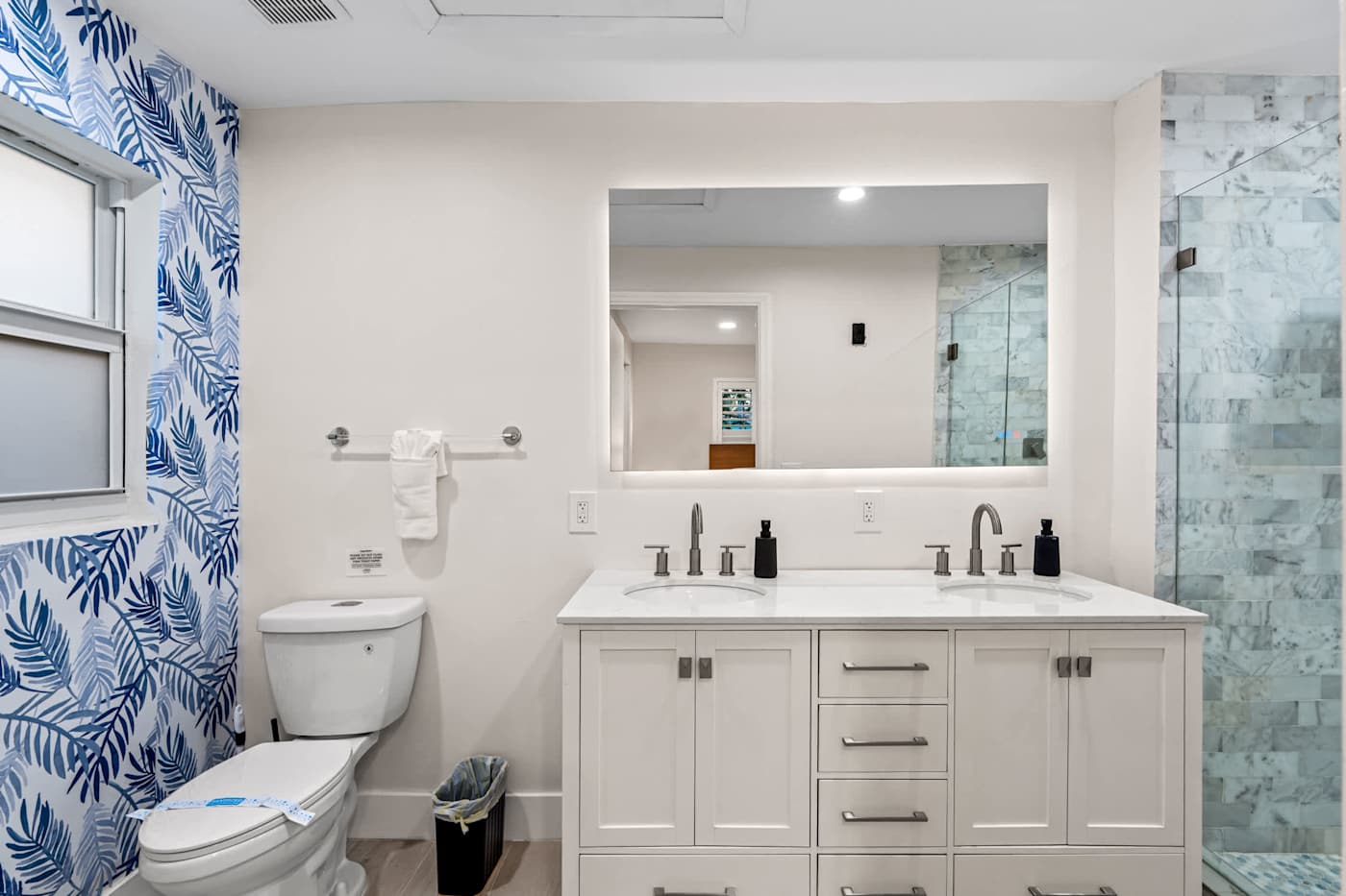 Canal House: Bathroom with vanity, mirror and a tiled walk in shower