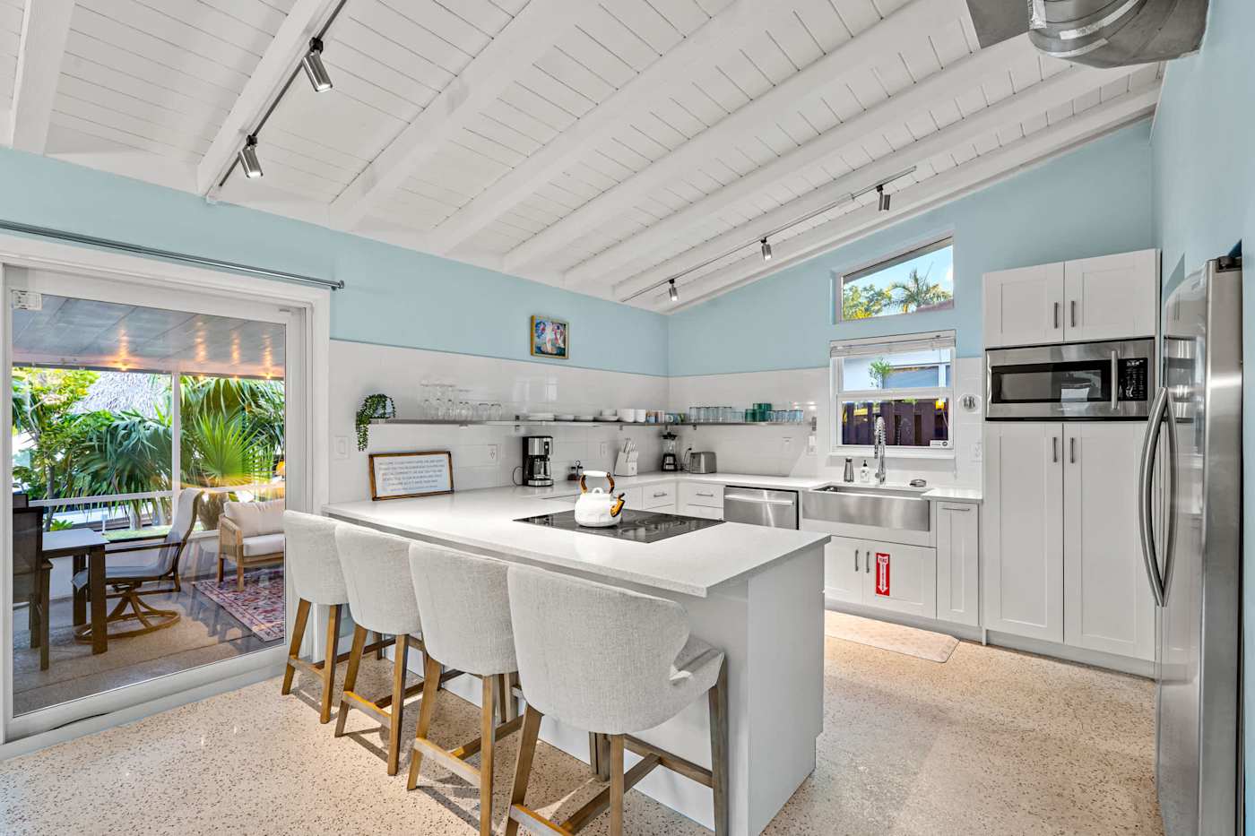 Canal House: Kitchen with island seating for four, under the vaulted ceiling