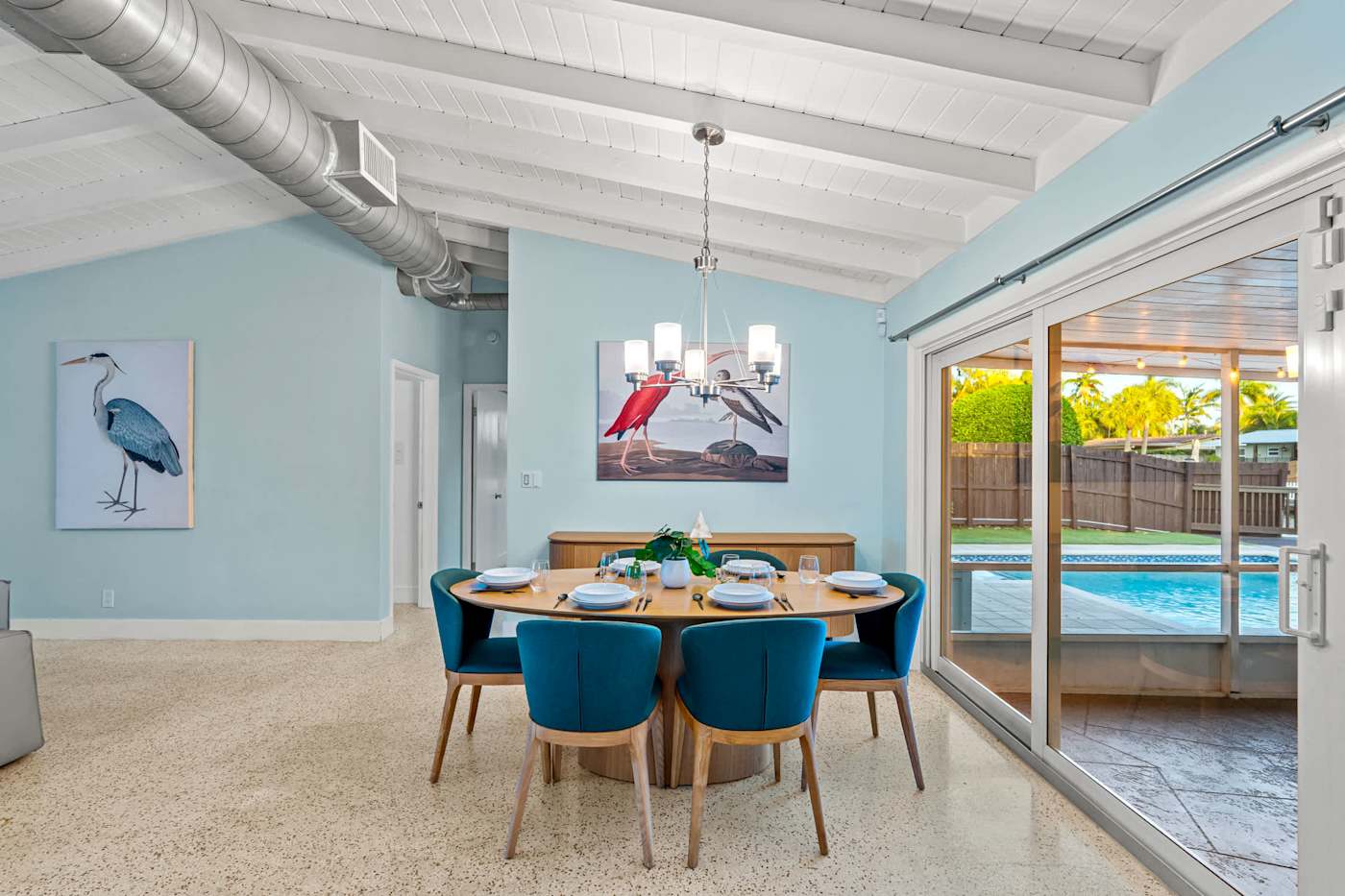 Canal House: Dining table for six, with the pool through the sliding doors