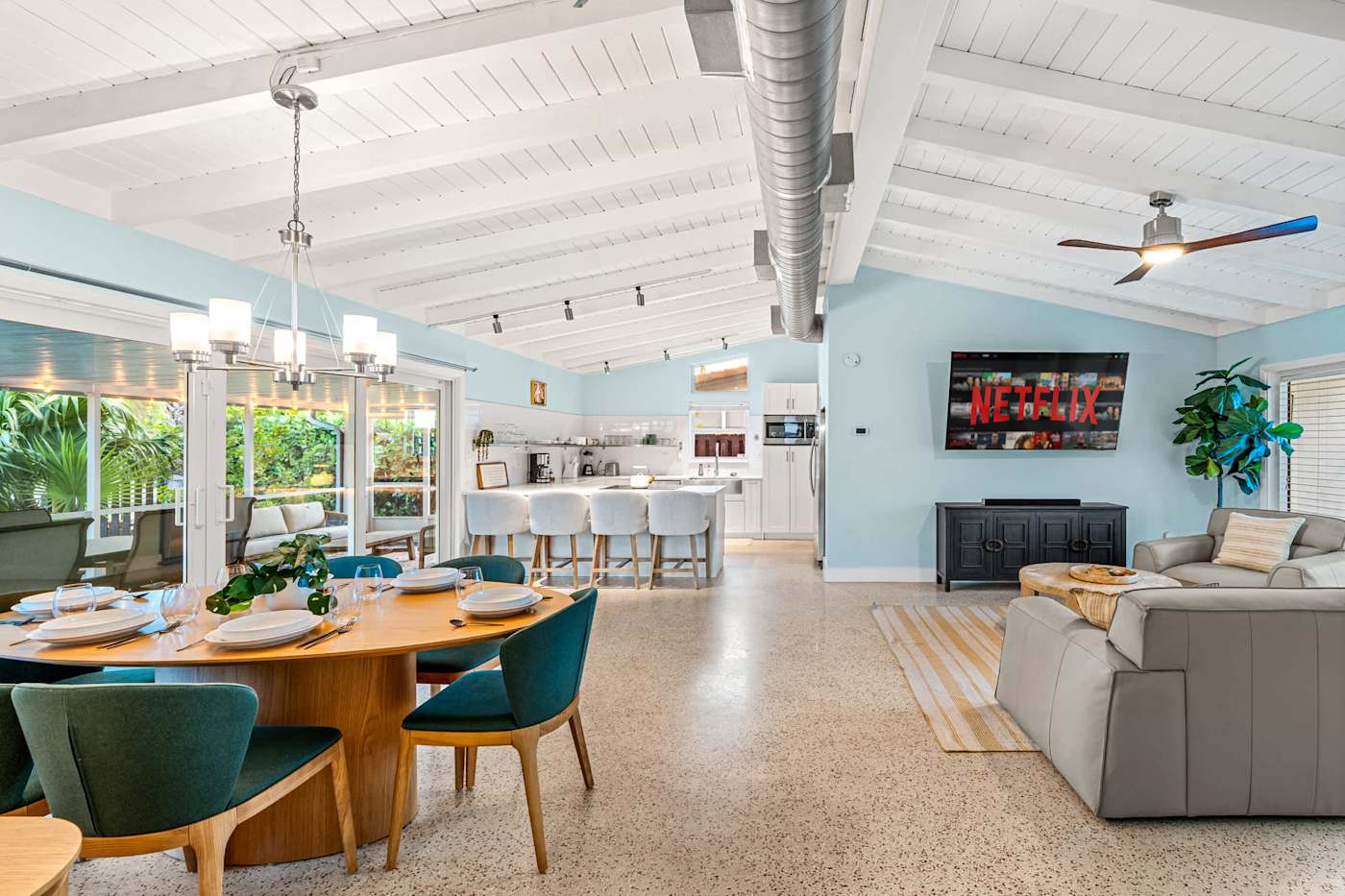 Canal House: Dining table and living room, open to the kitchen