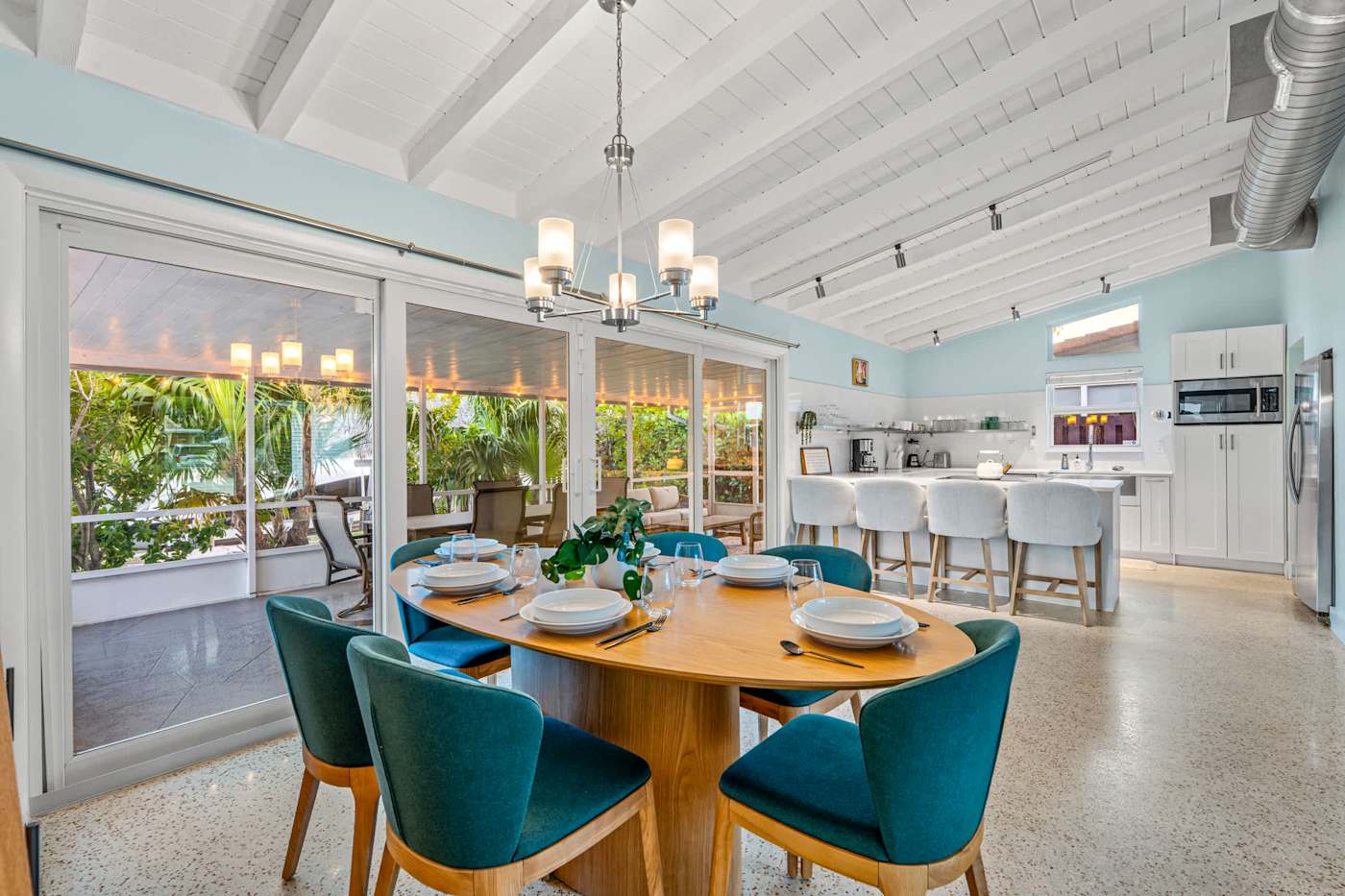 Canal House: Dining table for six, with the kitchen and porch beyond