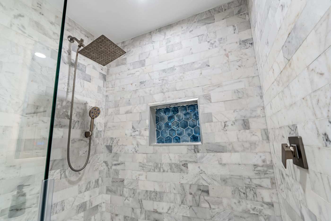 Canal House: Marble walk in shower with a rain head