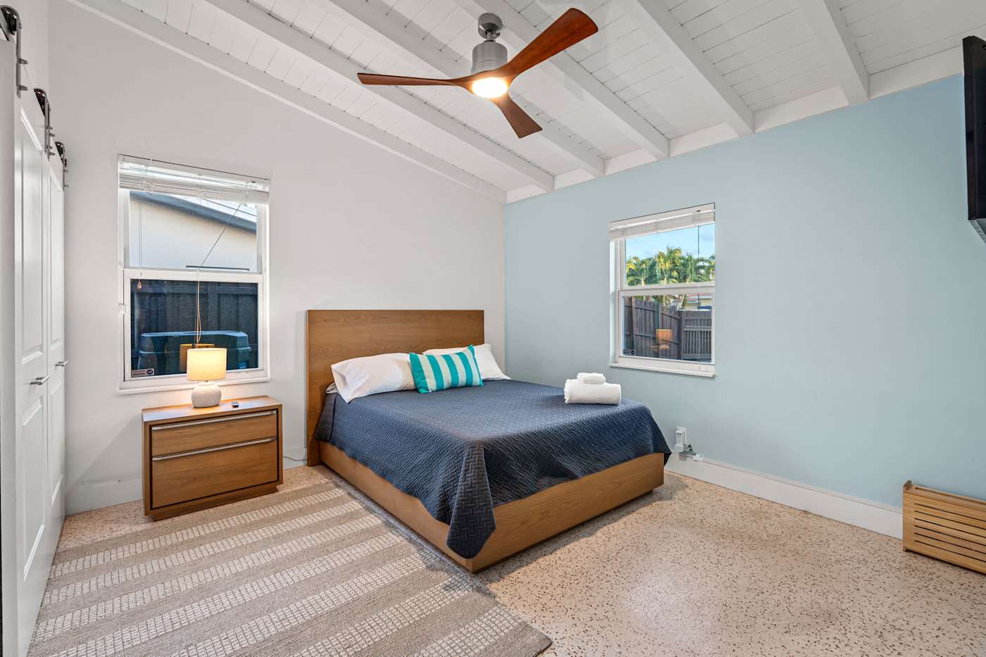 Canal House: Bedroom with double bed, bedside table and garden views