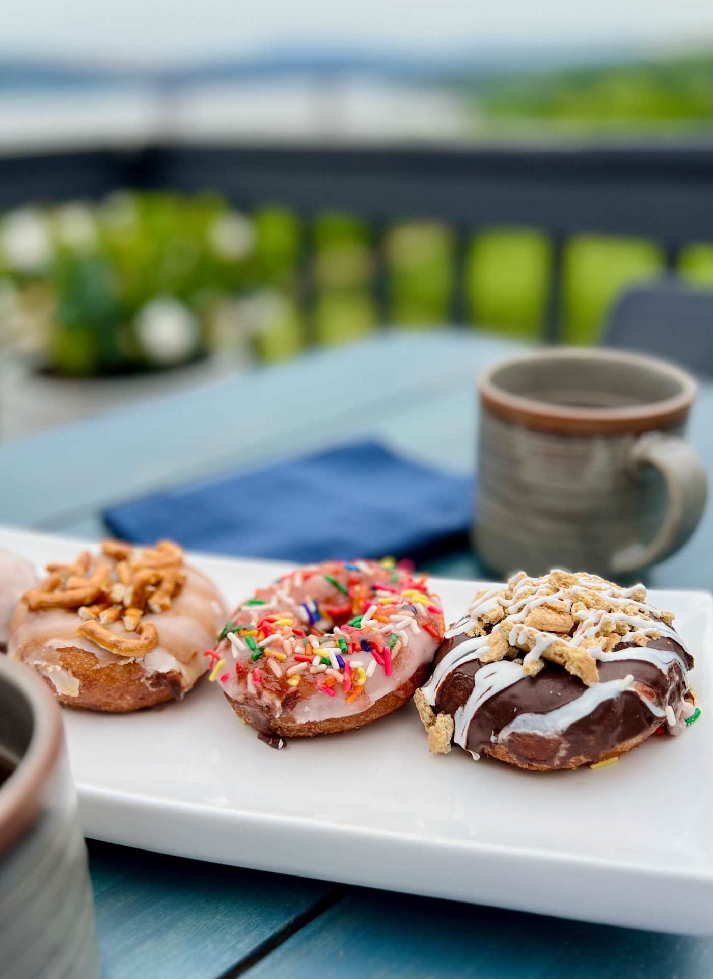 Hudson House: Donuts and coffee on the deck table