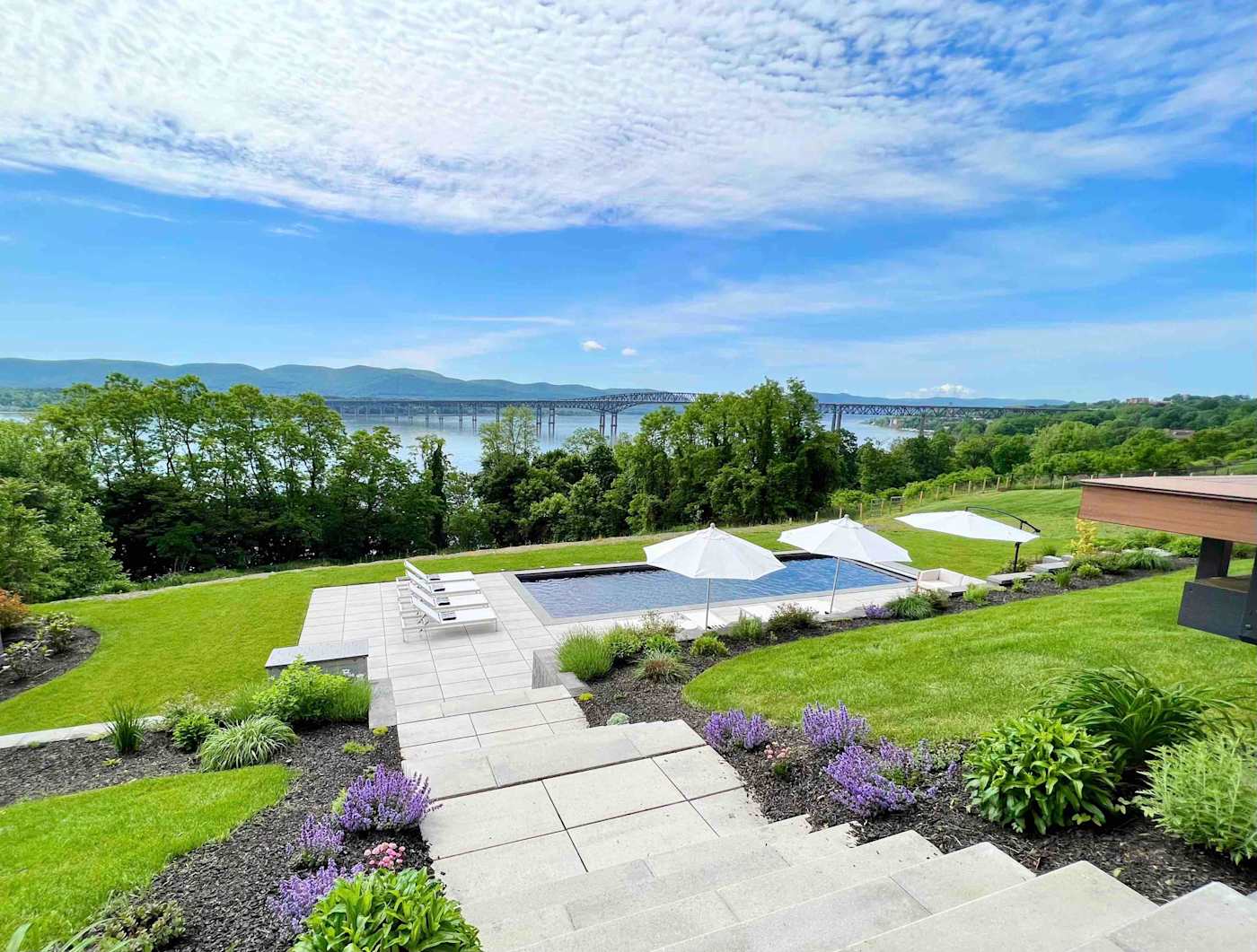 Hudson House: Stone steps through the gardens down to the pool, river beyond