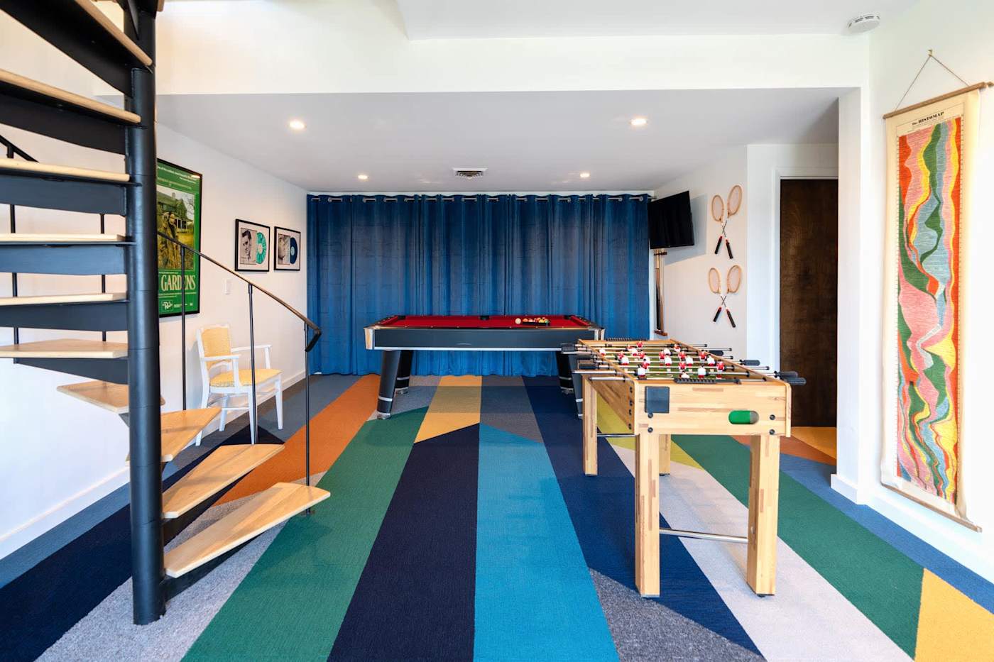 Hudson House: Game room with pool table, foosball and spiral staircase