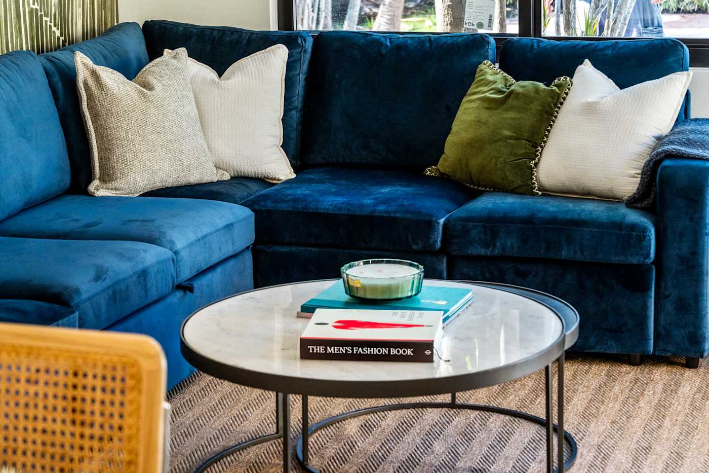 Mangrove Manor: Velvet sectional and marble coffee table in the main living room