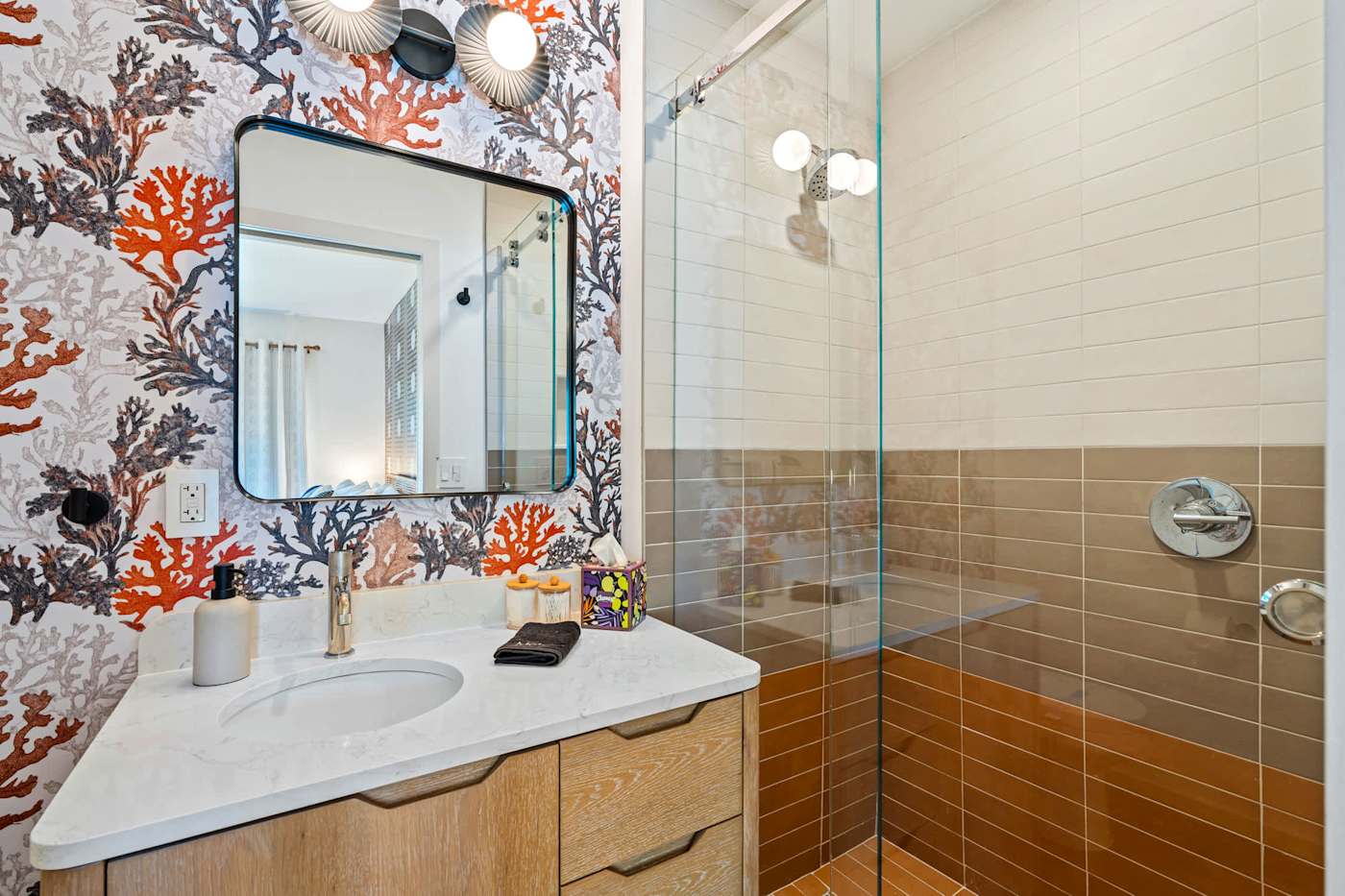 Mangrove Manor: Bathroom with walk in shower, glass screen and coral papered wall