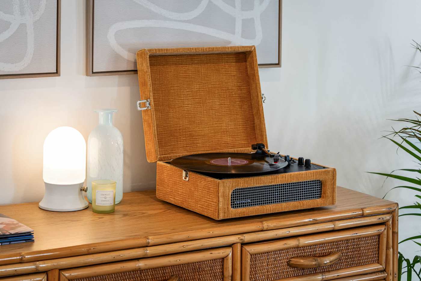 Mangrove Manor: Record player and vinyl on the rattan console