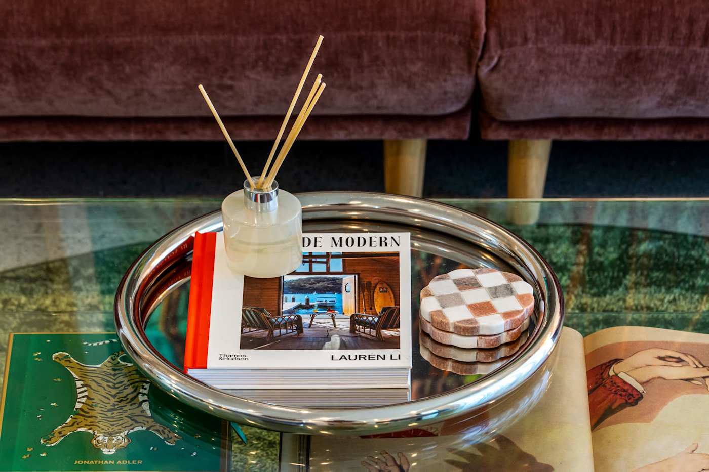 Mangrove Manor: Coffee table books and a reed diffuser in the main living room