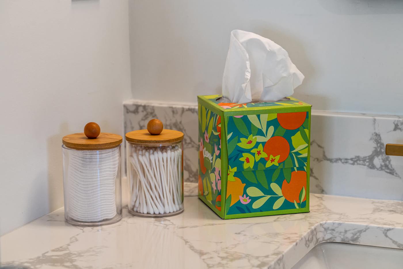 Mangrove Manor: Marble bathroom counter with cotton buds and everyday toiletries