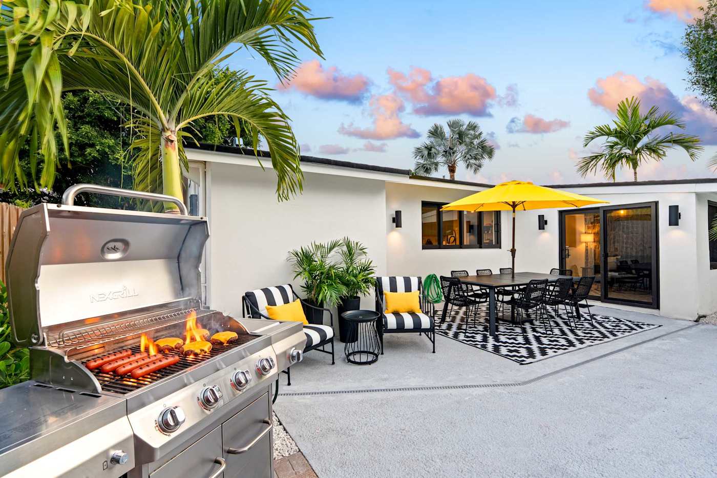 Mangrove Manor: Gas grill on the pool deck, next to the outdoor dining table