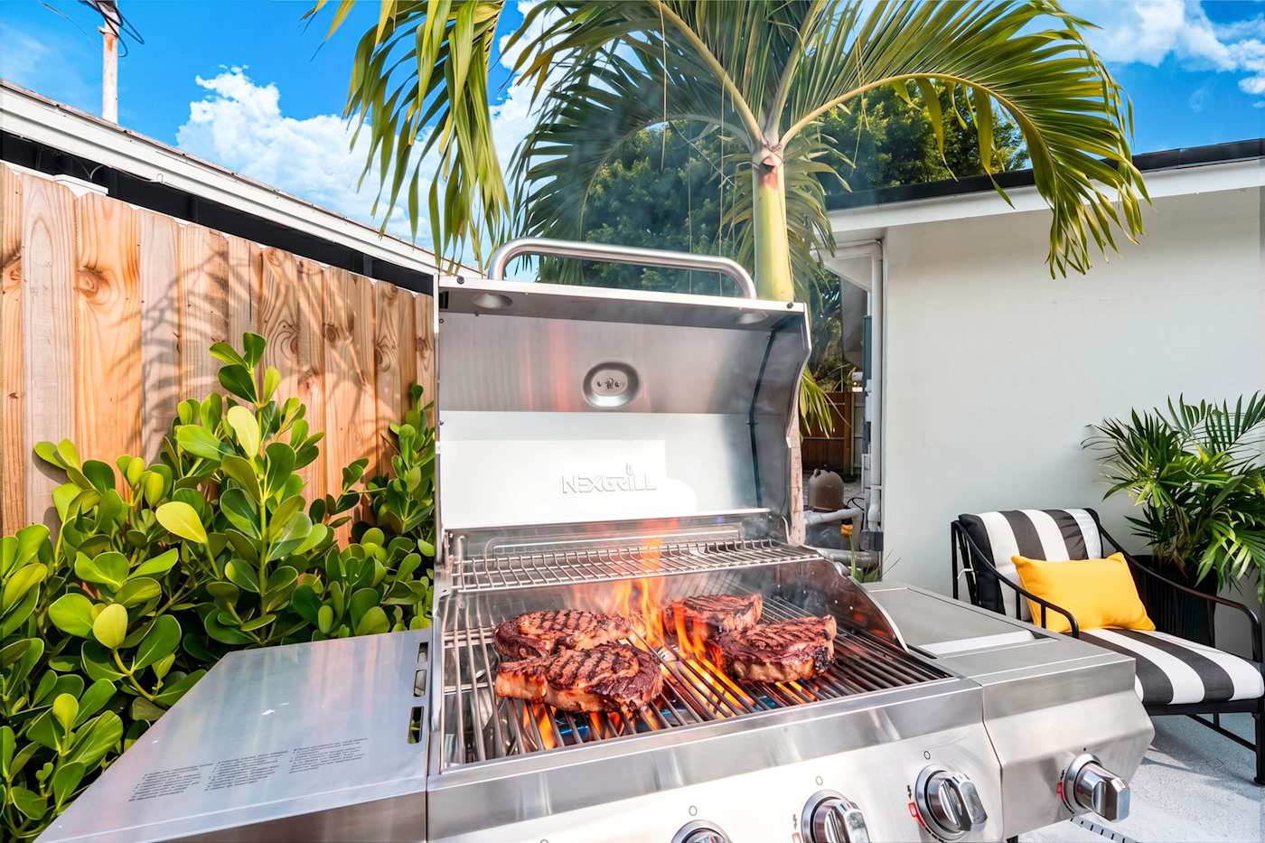 Mangrove Manor: Gas grill lit and ready on the pool deck