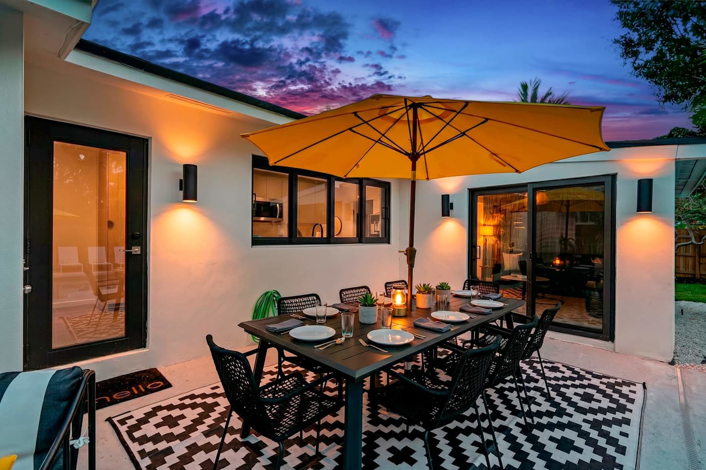 Mangrove Manor: Outdoor dining lit for the evening