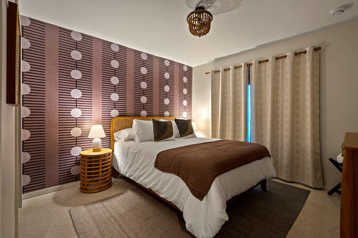 Mangrove Manor: Bedroom with feature wall, queen bed and blackout curtains