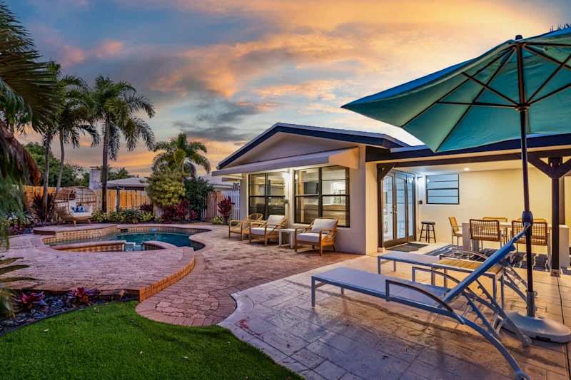 Gardens By The Sea: The garden at sunset, with the pool, spa and shaded patio