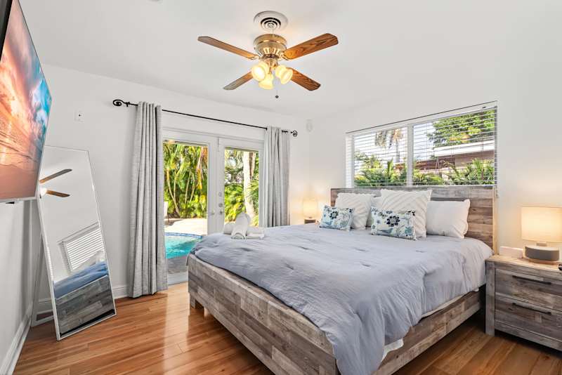 Cypress Cove: This bedroom has a king-size bed and direct access to the pool area