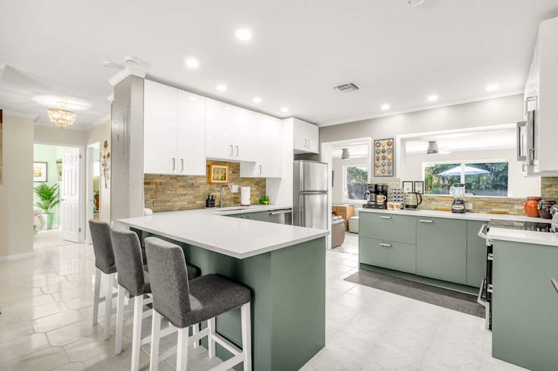 The Fairway: Kitchen with island seating, fridge freezer and coffee station