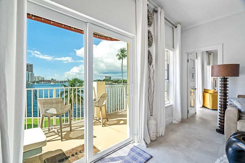 Ocean Block: Sliding glass doors open to a balcony with seating and water views