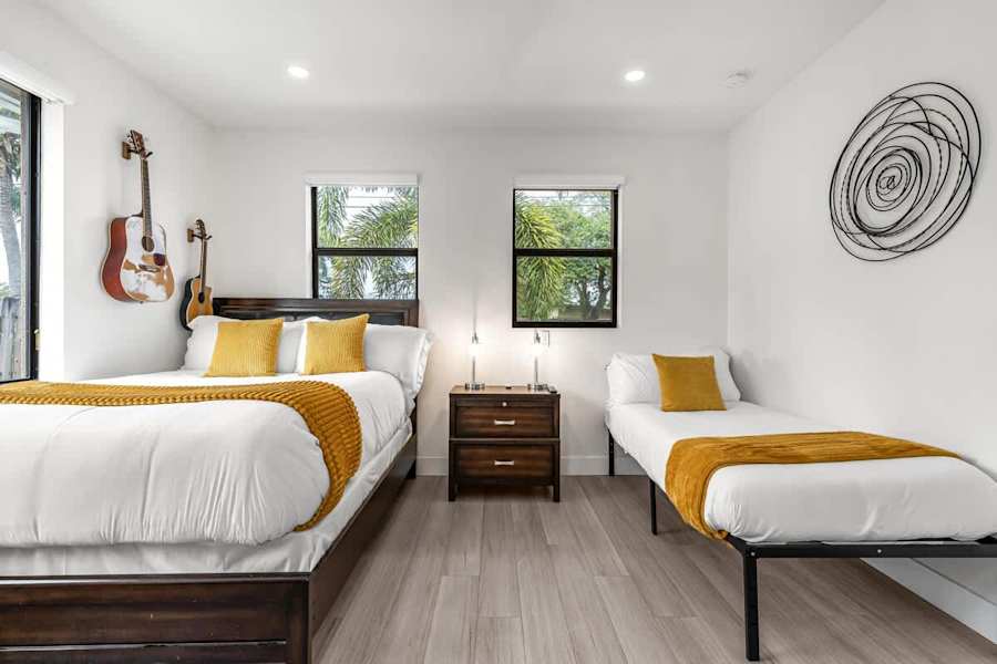 The Arcade House: Bedroom with king bed and a single bed, sleeping three