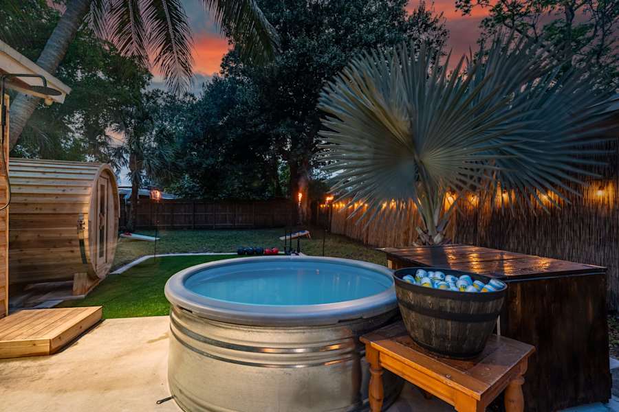 EV Retreat: The backyard has a cold plunge tub next to the barrel sauna