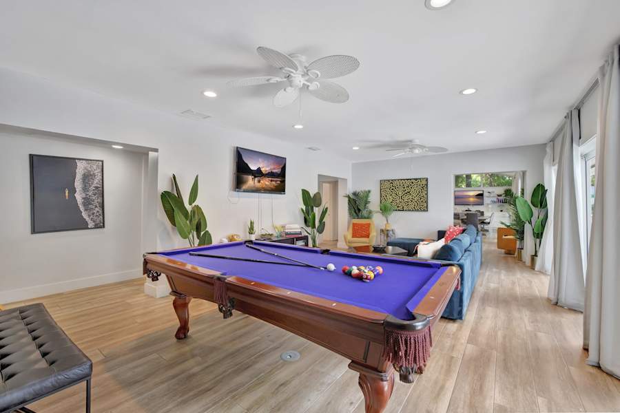 6 Bed Beach House: Pool table with seating and a smart TV alongside