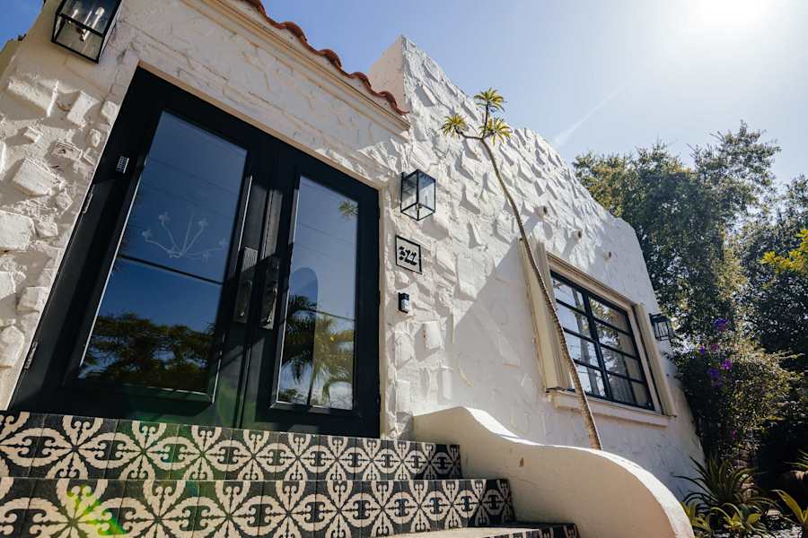 Sol y Sombra: Front view of the house with unique stairs and tile