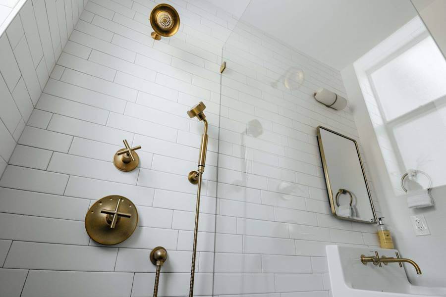 Sol y Sombra: Full shower with gold accents. Shampoo, conditioner and body wash provided with fresh towels as well