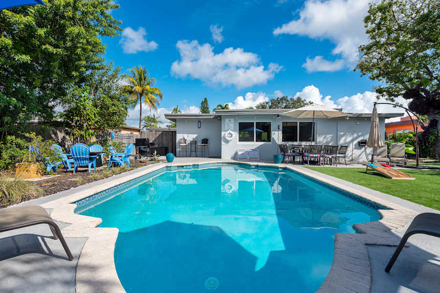The Fairway: Heated pool and putting green, with the house behind