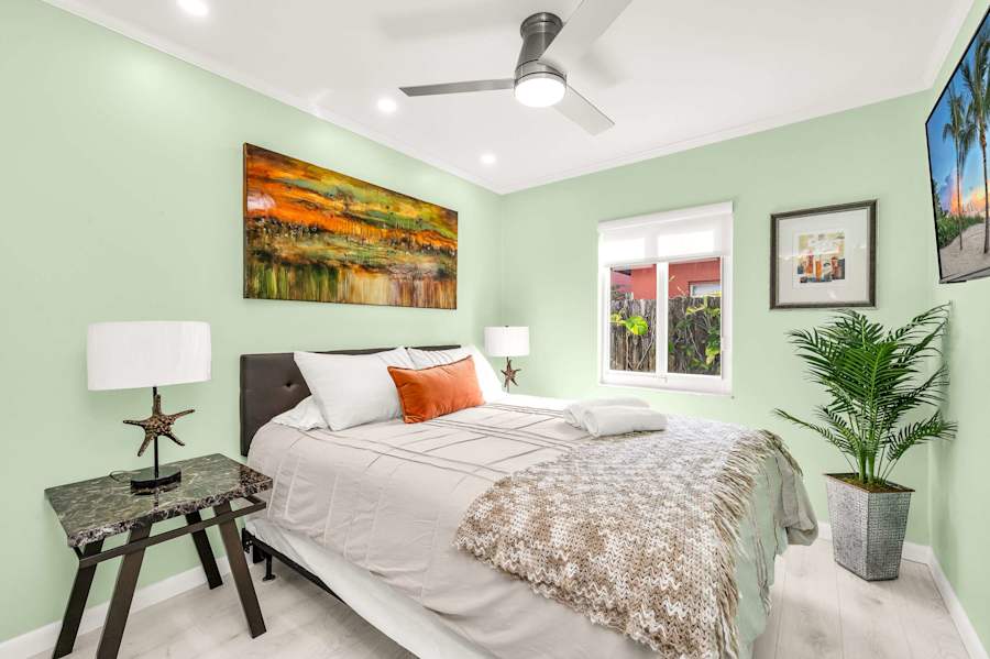 The Fairway: Bedroom with king bed, bedside lamps and a smart TV