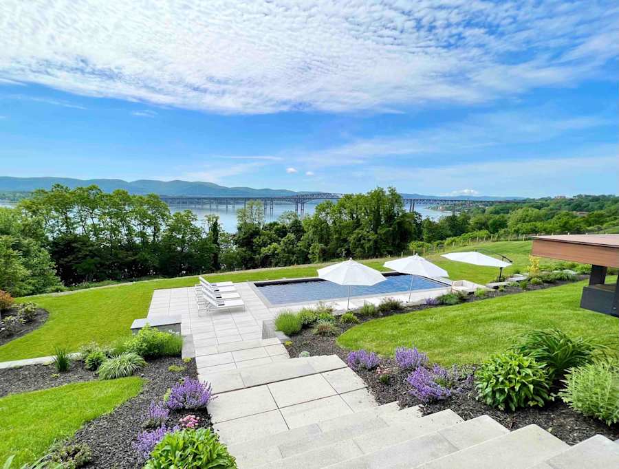 Hudson House: Stone steps through the gardens down to the pool, river beyond