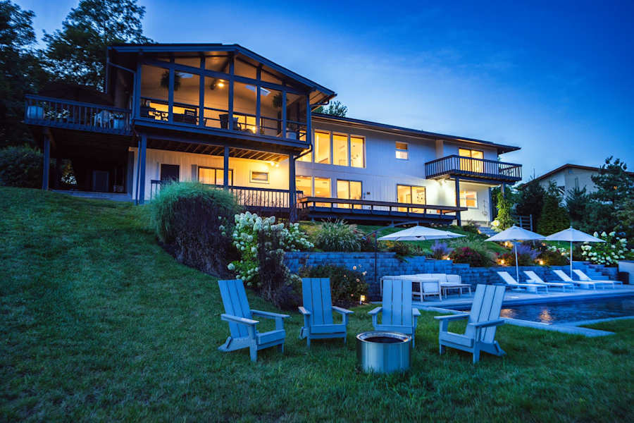 Hudson House: Fire pit and Adirondack chairs on the lawn behind the house