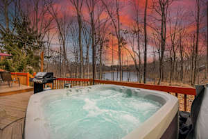 Hot Tub Oasis: Relax and unwind in your own retreat with lakeside views and a spectacular sunset!
