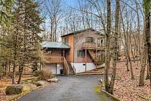 Surrounded by trees, this charming retreat offers the perfect blend of nature and comfort for a relaxing getaway!