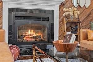 Relax by the elegant gas fireplace—effortless warmth and ambiance at the touch of a button.
