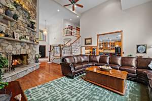 Drop into the sectional with the fireplace going - this is the room where all twenty of you end up without anyone planning it.