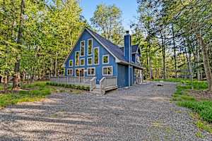 Step into this charming blue cabin, surrounded by a serene forest, and enjoy the warmth of the morning sun. Your peaceful getaway awaits. 🌲✨ #TranquilEscape