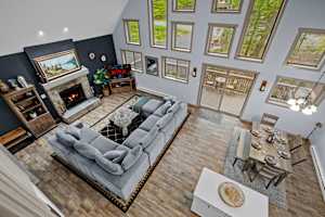 Spacious great room featuring a large sectional sofa, perfect for both relaxation and entertaining. High ceilings and plenty of natural light make this space bright and inviting.