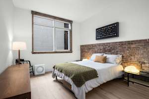 Photo #2 of Library Loft | Modern 2BR Condo with Private Terrace & Gym