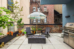 Photo #4 of Library Loft | Modern 2BR Condo with Private Terrace & Gym