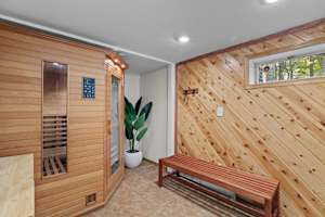 Relax and rejuvenate in this private sauna, featuring warm natural wood accents and a calming atmosphere—your perfect retreat to unwind!