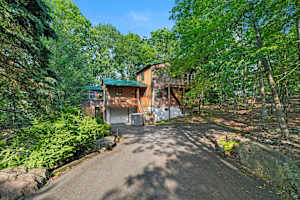 Surrounded by trees, this charming retreat offers the perfect blend of nature and comfort for a relaxing getaway!