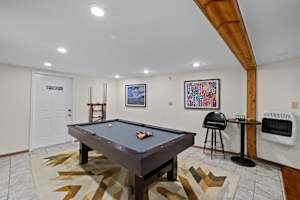 Game Room: Enjoy a lively game of pool with friends in this art-filled space—perfect for entertainment and relaxation during your stay!